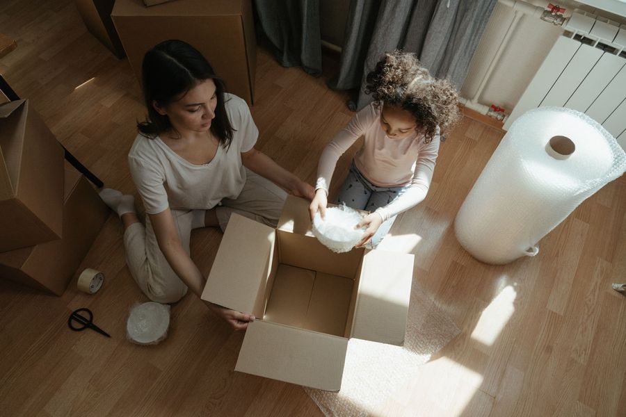 Packing boxes with bubble wrap and tape