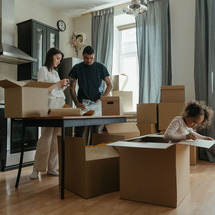 Unpacking boxes in the kitchen of a new home